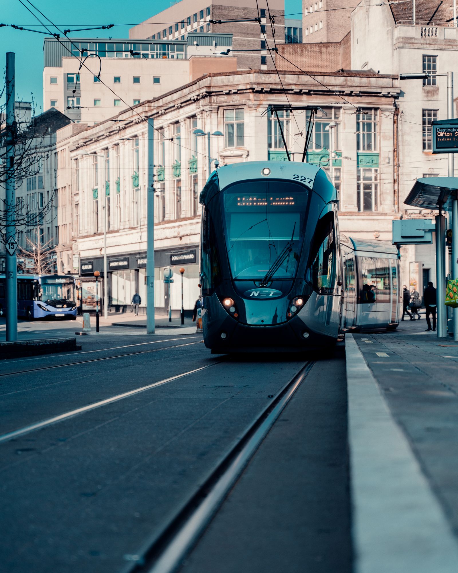A NET tram running through Nottingham city centre