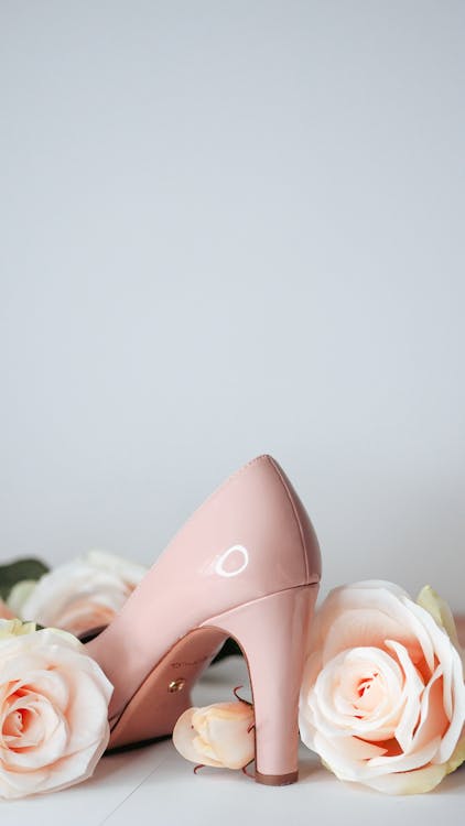 Free Close-up of a Pink High Heel Shoe and Roses Stock Photo
