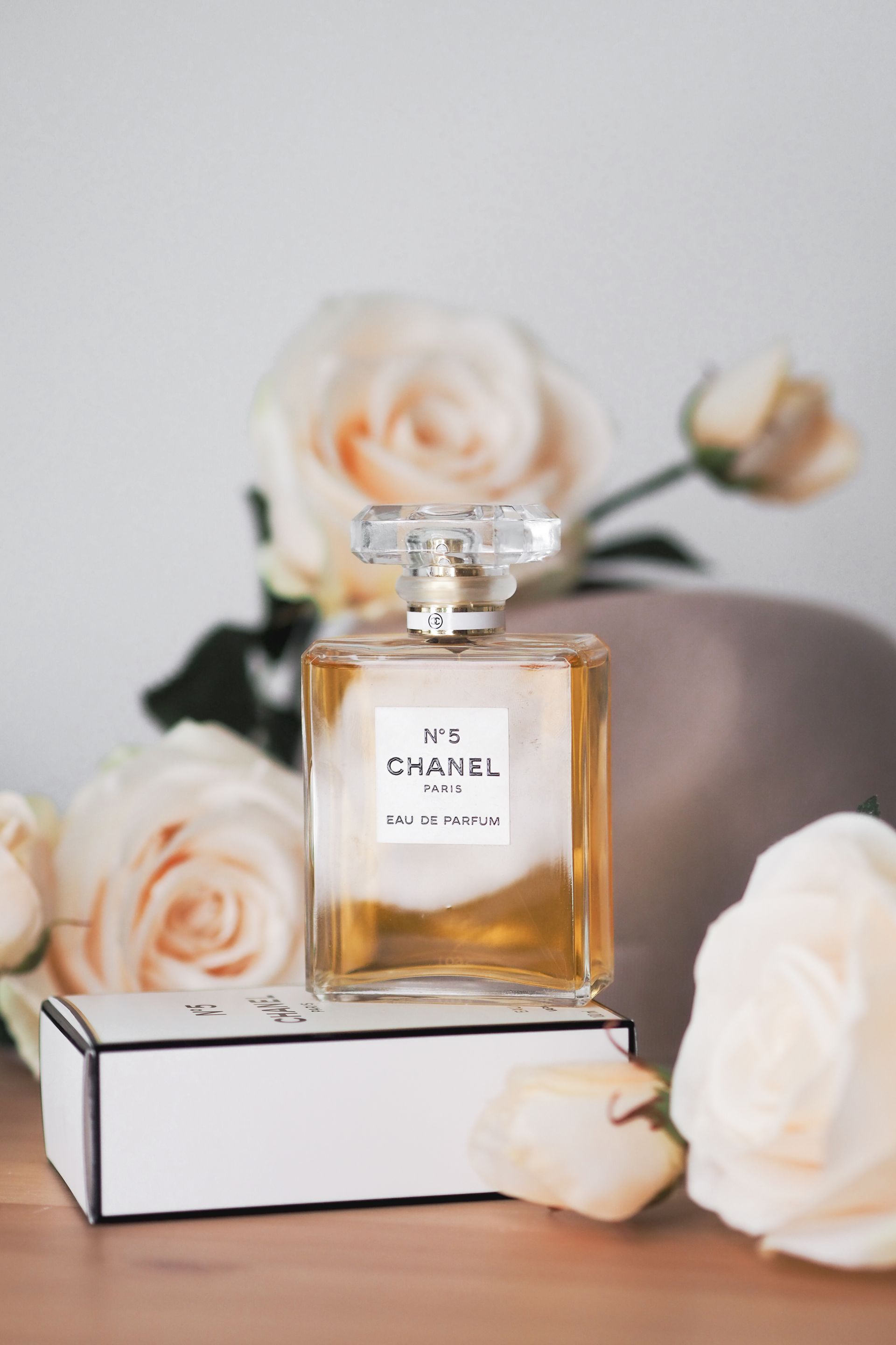 Chanel No. 5 perfume bottle with elegant roses - Photo by Laura Chouette on Pexels