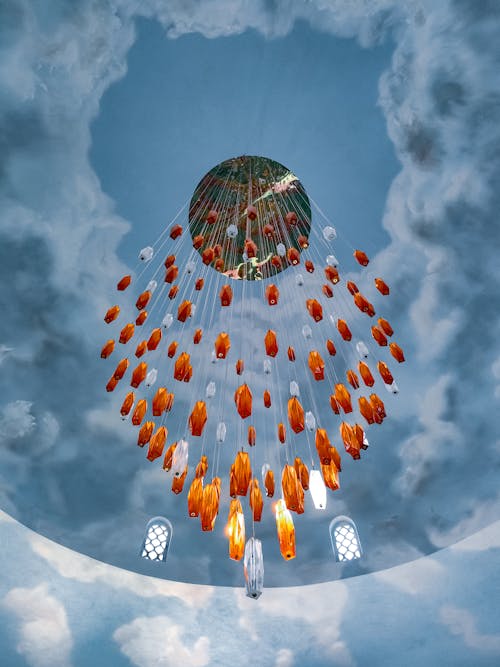 A large chandelier with orange and red flowers