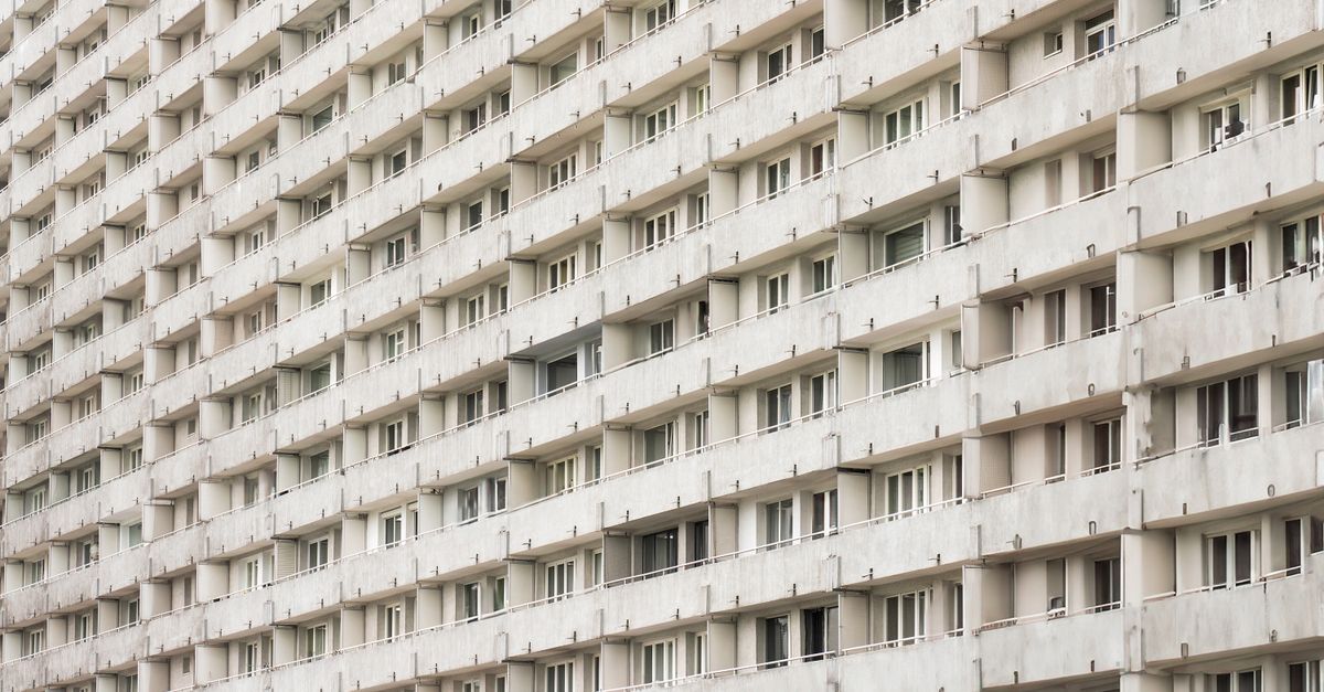 Perspective view of a geometric residential building facade in Katowice, Poland.