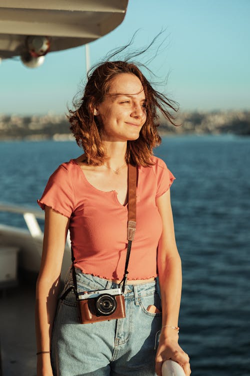 Brunette Woman with Camera on a Boat