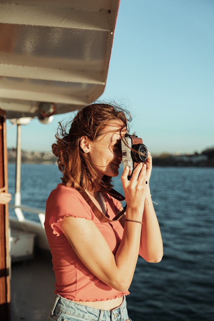 Woman Sailing And Taking Pictures