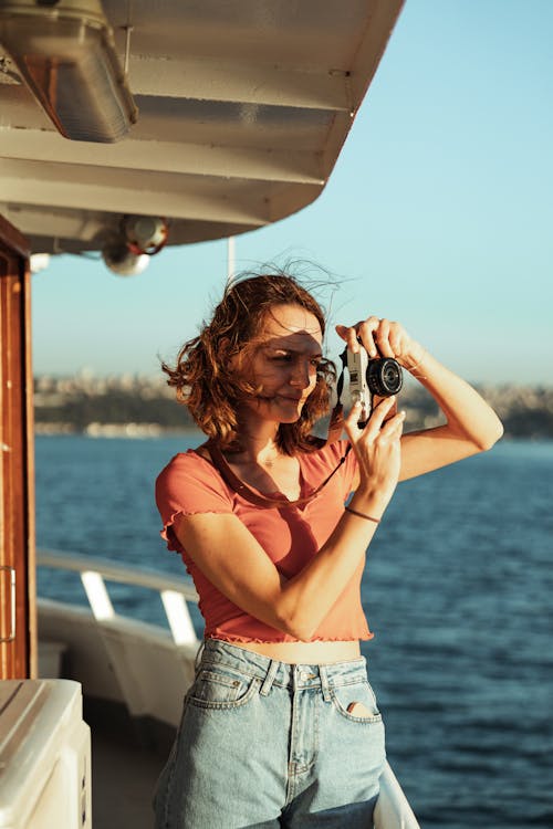 Brunette Woman with Camera on a Boat