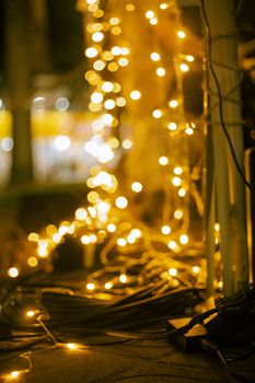 Close-up of glowing decorative lights creating a cozy festive atmosphere outdoors.
