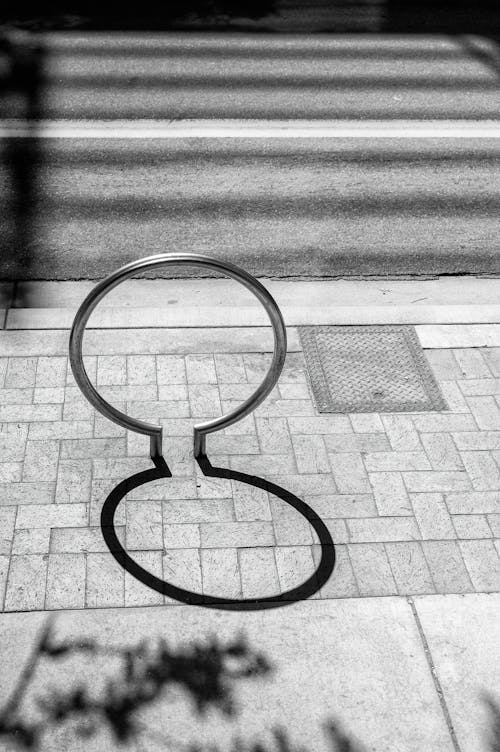 A black and white photo of a bicycle rack