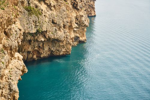 Free Stunning view of Antalya's cliffs and turquoise sea, perfect for travel inspiration. Stock Photo