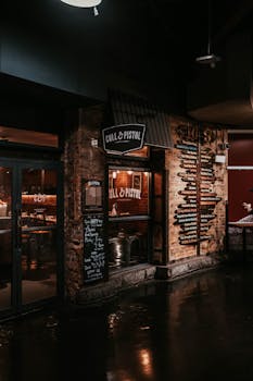 Evening view of Cull & Pistol restaurant exterior with illuminated signage in New York City.