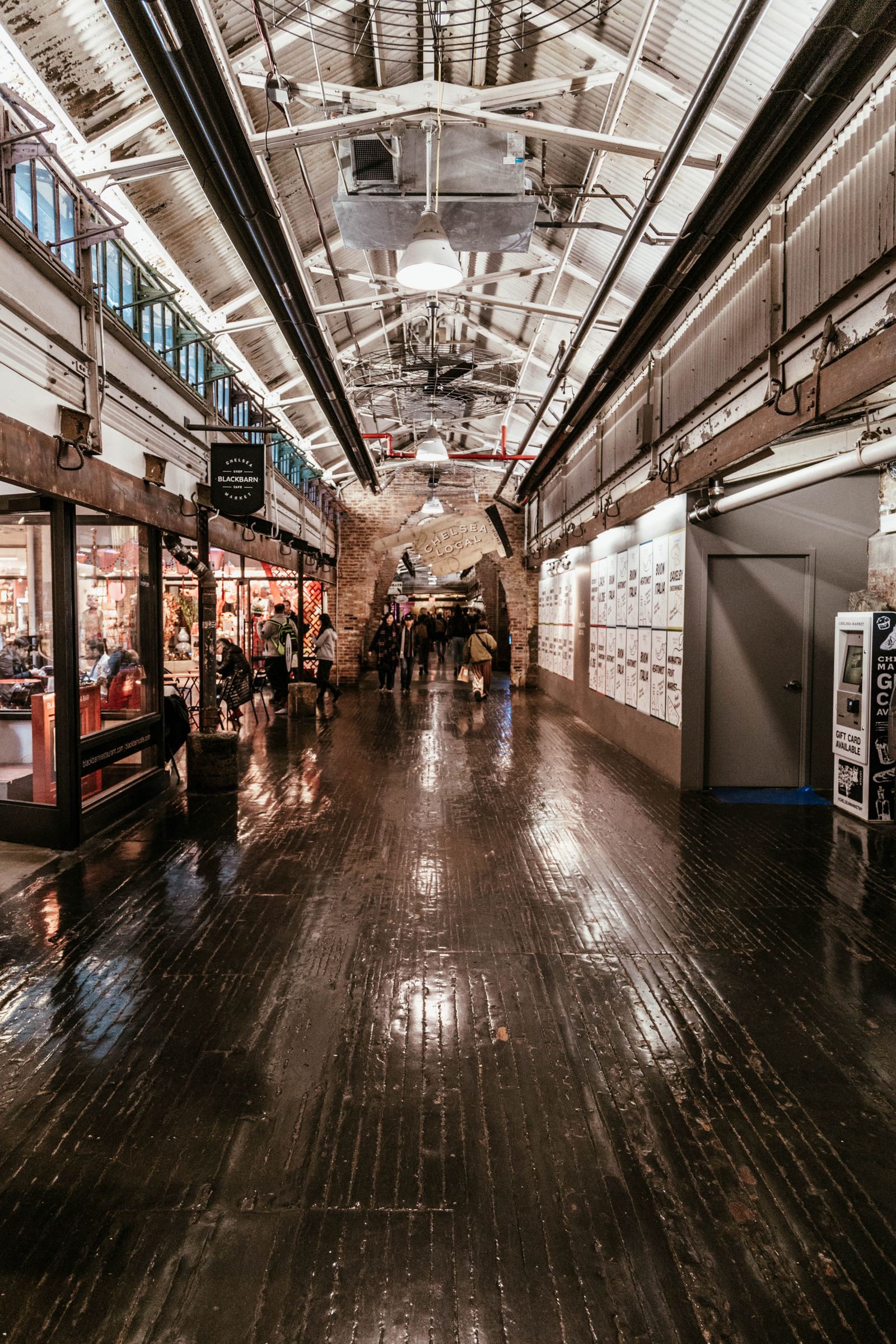 Shoppers browsing the stalls inside Chelsea Market