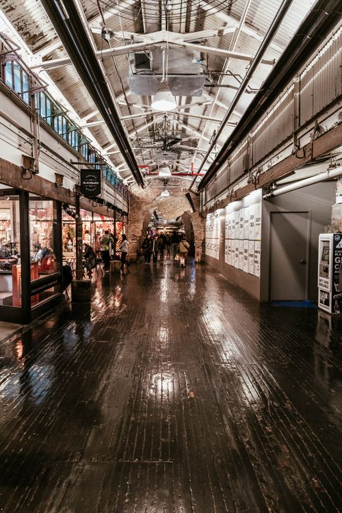 Free Explore the bustling interior of Chelsea Market, capturing vibrant shops and visitors in New York City. Stock Photo