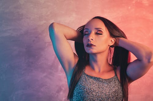 Portrait of Woman Fixing Hair