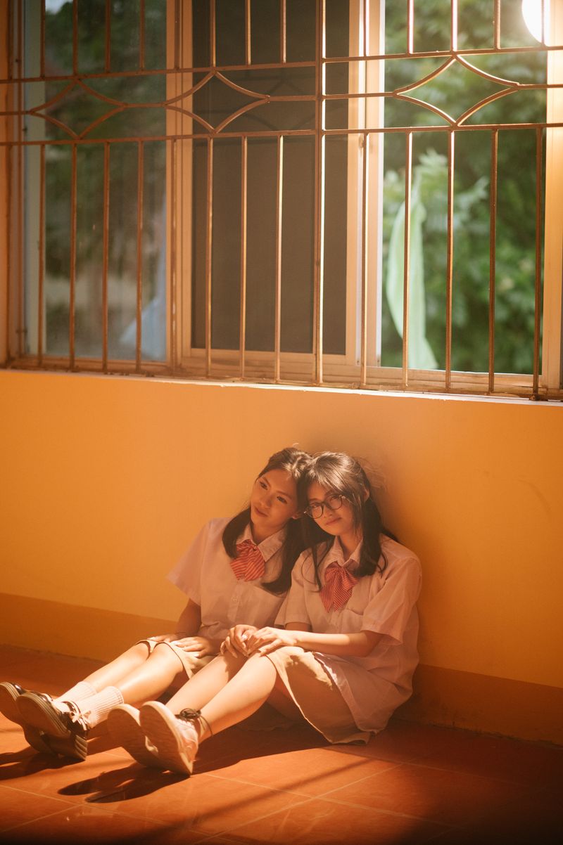 Two Girls Sitting on the Floor · Free Stock Photo