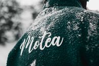 Close-up of a teal jacket with snow and Motéa branding in Brezovica, Serbia.