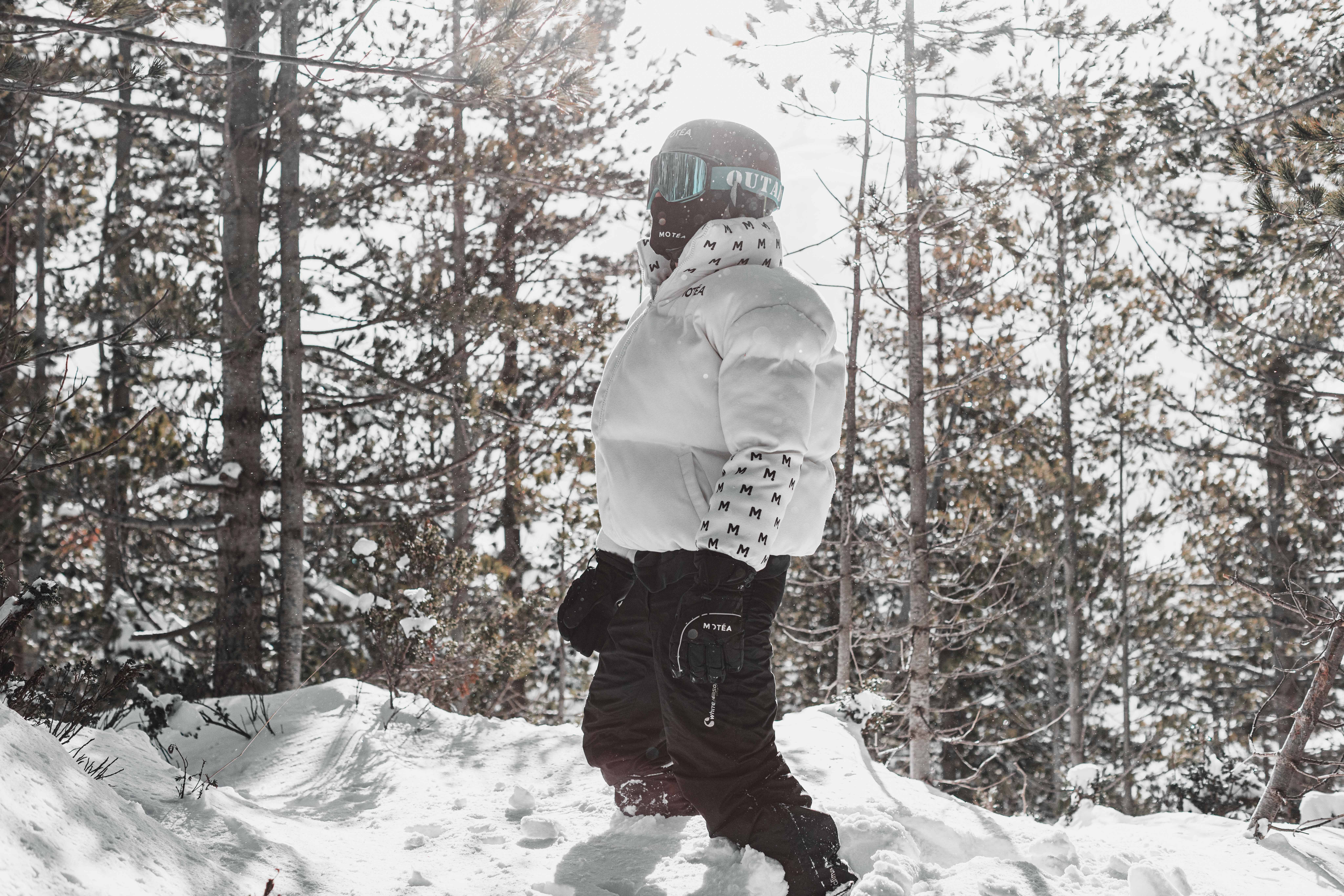 Person in Jacket and Helmet in Snow in Forest · Free Stock Photo