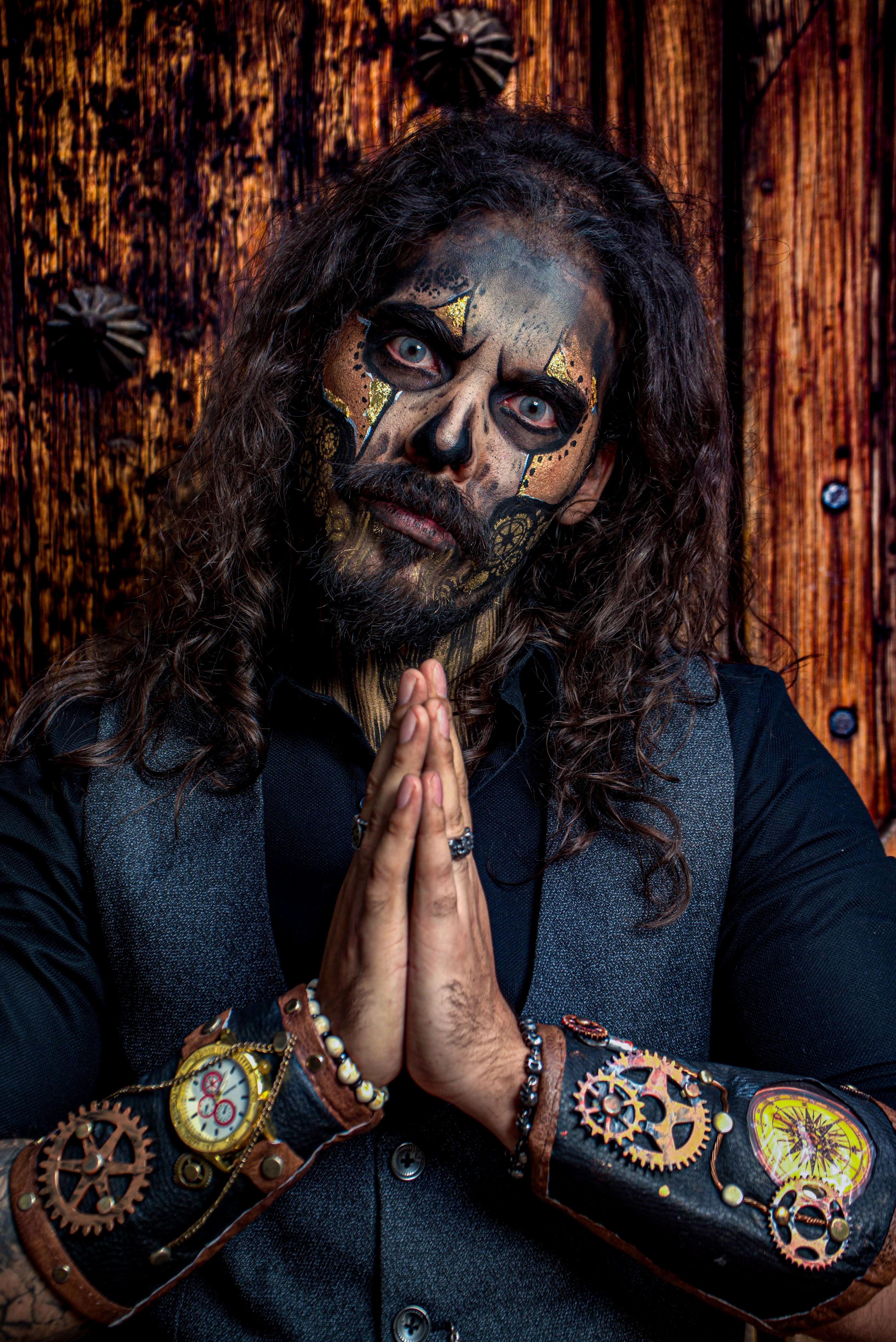 Portrait of a man with detailed steampunk makeup and accessories, perfect for Halloween enthusiasts.
