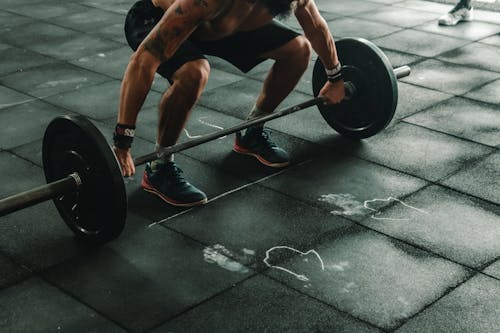 Free Man About to Lift Barbell Stock Photo