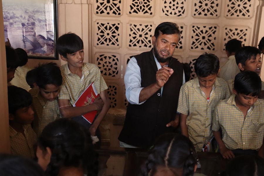 Teacher guiding students through a values lesson at Gurukul Heritage Academy