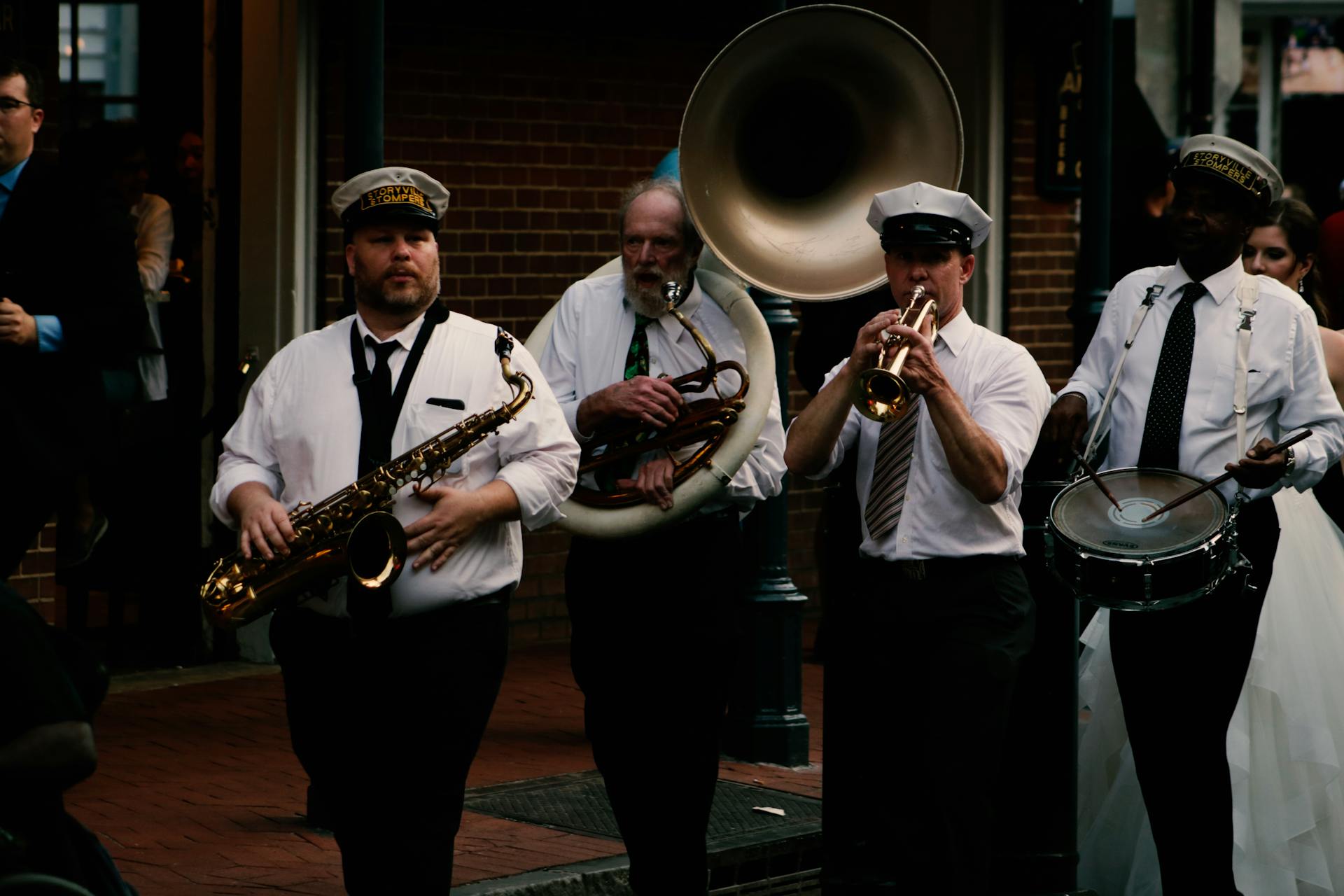 Four Men Playing Musical Instruments