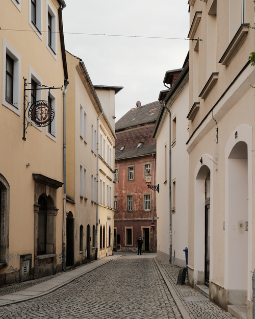 Free Charming cobblestone street in Zittau's old town, showcasing gothic architecture. Stock Photo