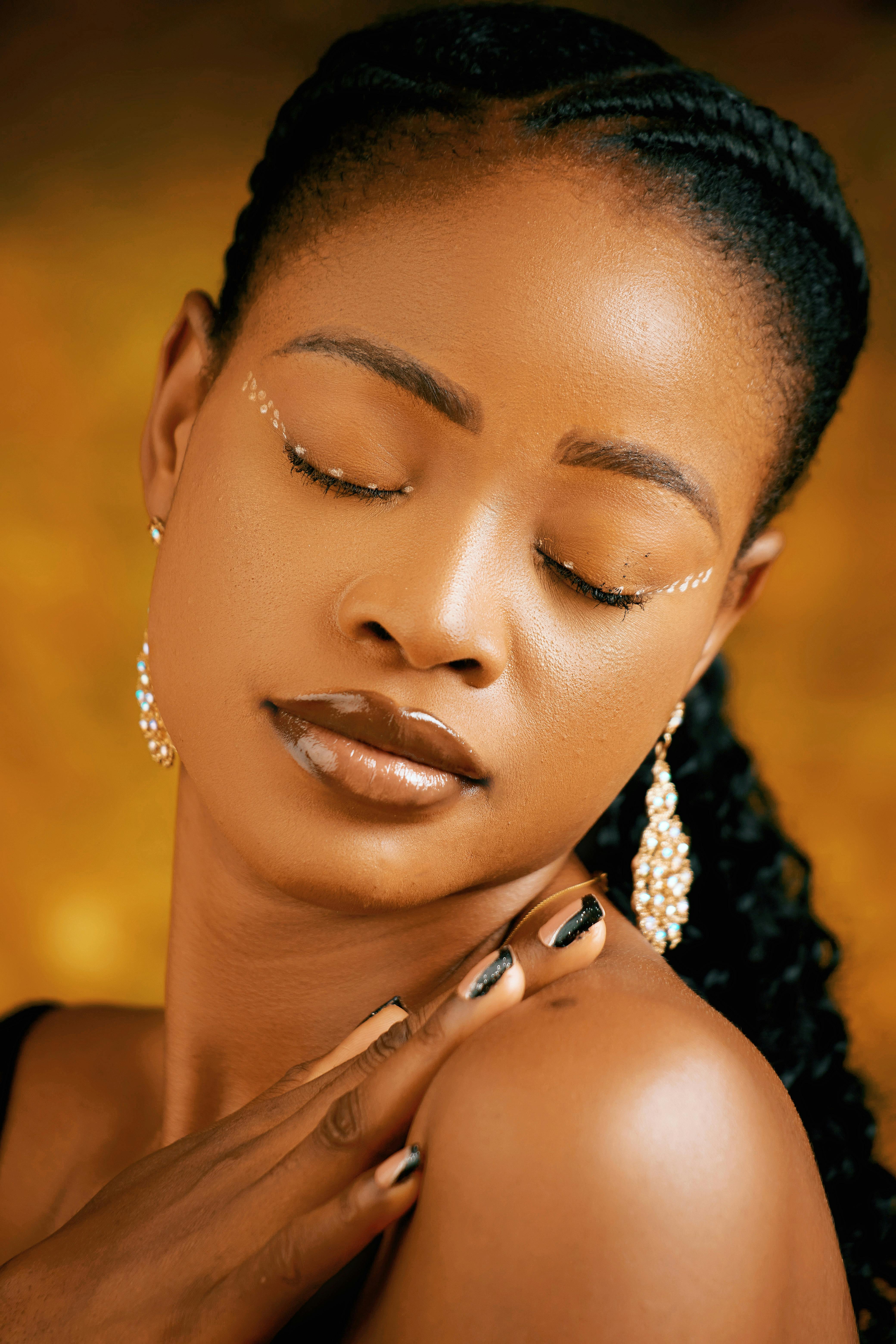 portrait of woman wearing golden jewelry