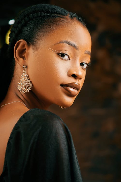 Portrait of Woman Wearing Golden Jewelry 