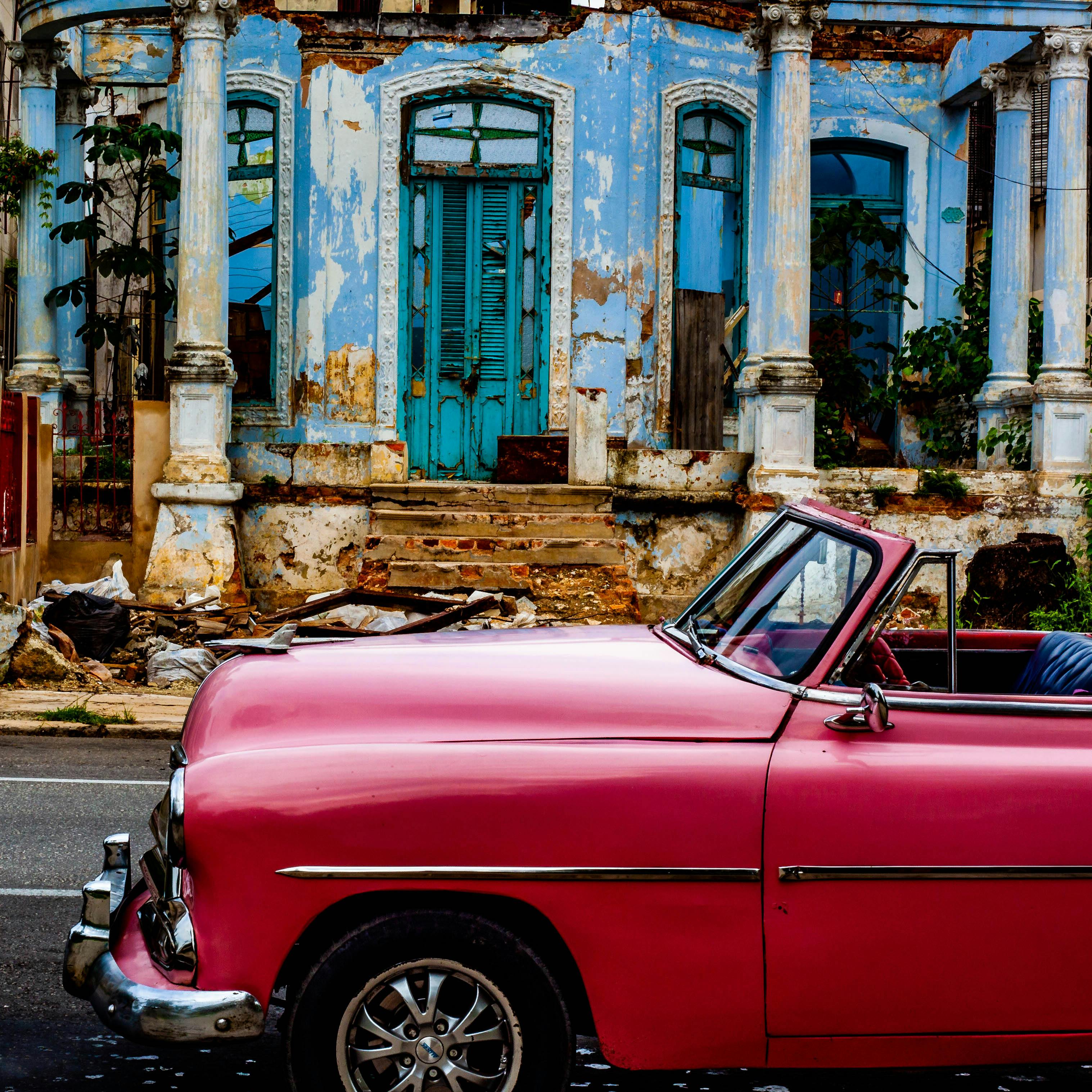 Wallpaper murals Vibrant illustration of American vintage cars in Havana  Cuba at sunset Colorful exotic retro Havanas streets make a magnigicent  magical cityscape Generative AI  NikkelArtcouk