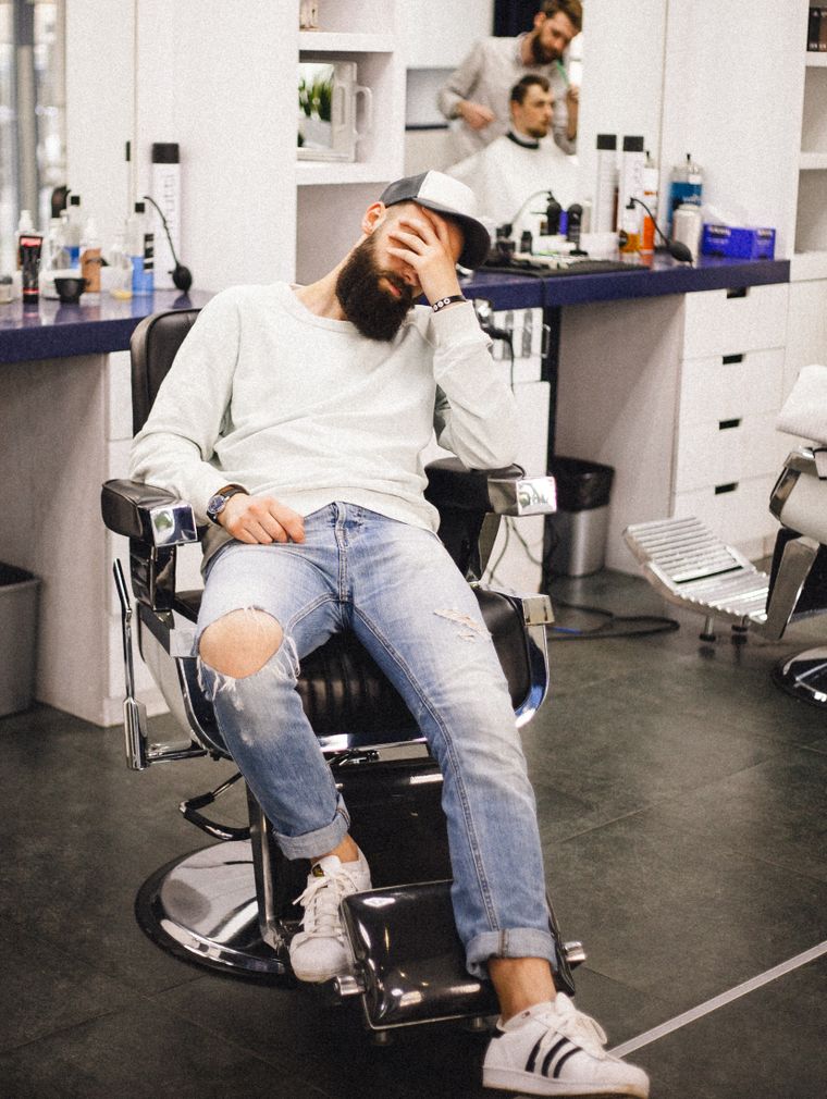 Man sitting on a barber's chair