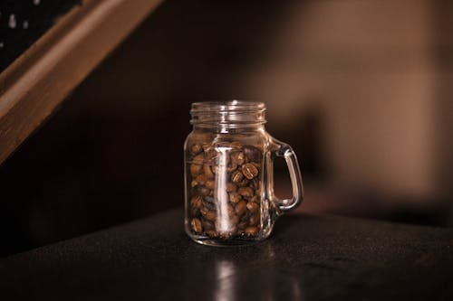 Free Filled Coffee Bean Clear Glass Mug Stock Photo
