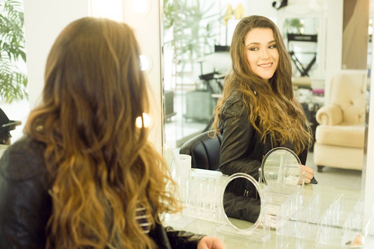 Woman Looking At The Mirror