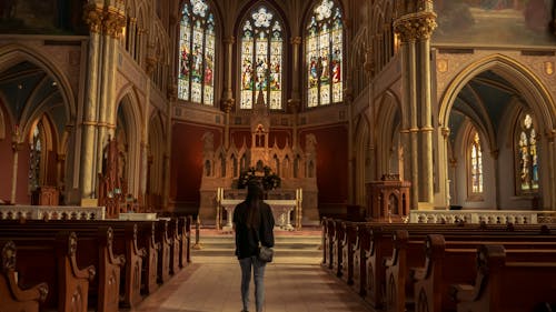 Free Girl in Front of Church Alter Stock Photo