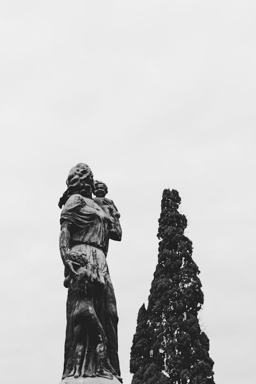 A black and white photo of a statue