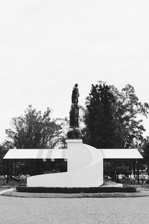 A black and white photo of a statue