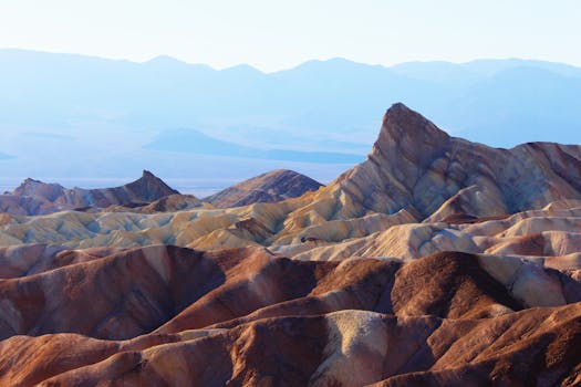 Stunning view of rock formations in Death Valley under bright daylight.
