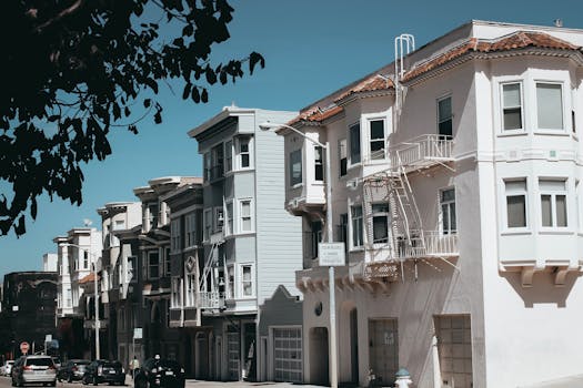 A tranquil street view showcasing classic San Francisco architecture with charming homes and calm urban vibes.