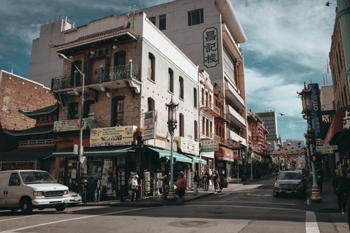 Free A vibrant street scene in San Francisco's Chinatown with shops, people, and historic architecture. Stock Photo