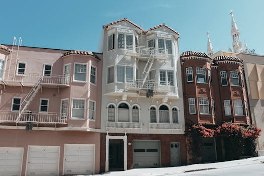 Charming Victorian buildings on a sunny San Francisco street.