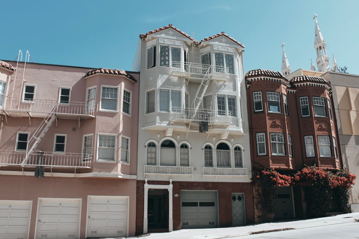 Row of townhouses along a sunny residential street in Brindle Cove