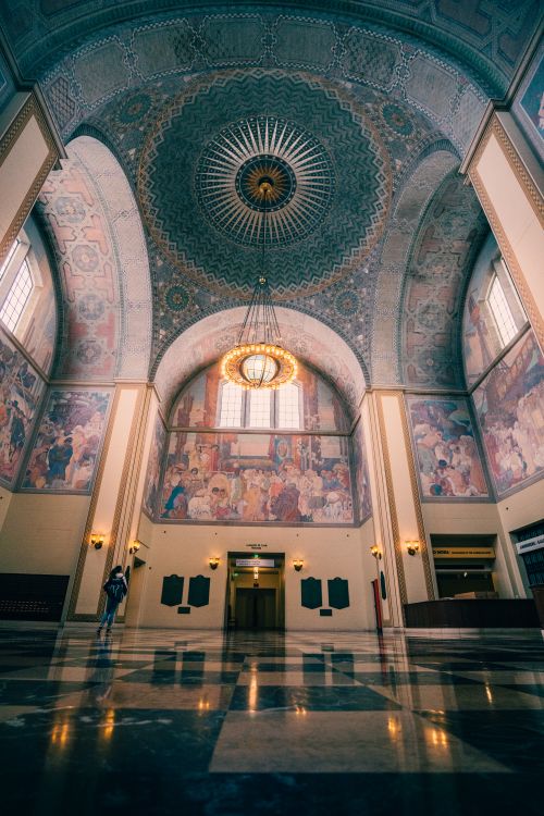 Free Captivating Art Deco interior with ornate ceiling and mural walls in Los Angeles. Stock Photo