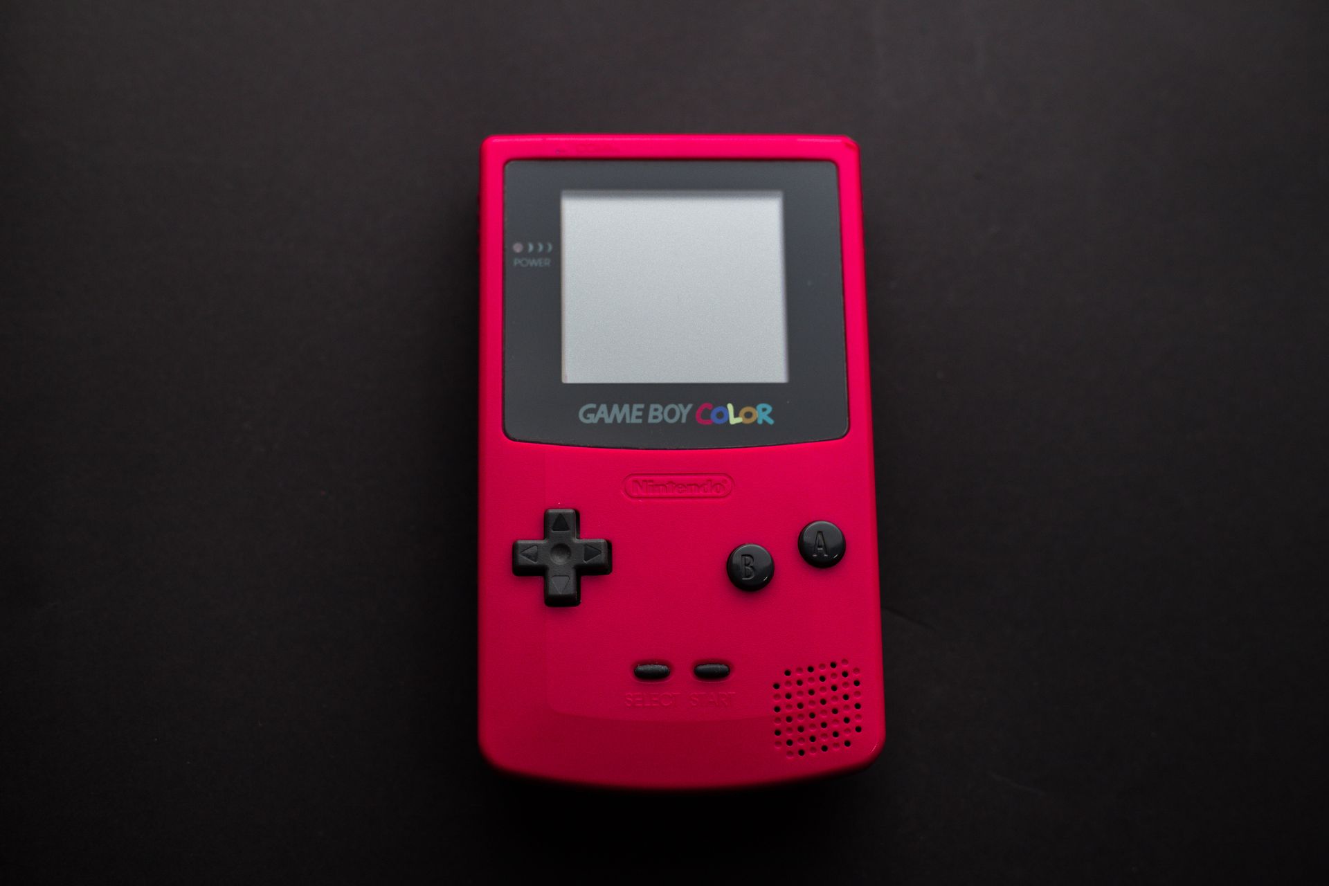 Close-up Photo of Red Game Boy Console