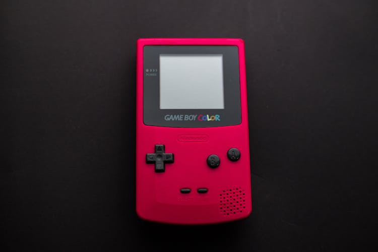 Close-up Photo Of Red Game Boy Console