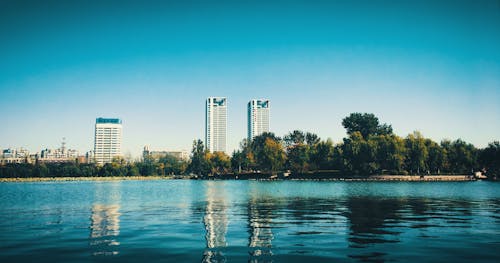 View Of Lake With Buildings On Background