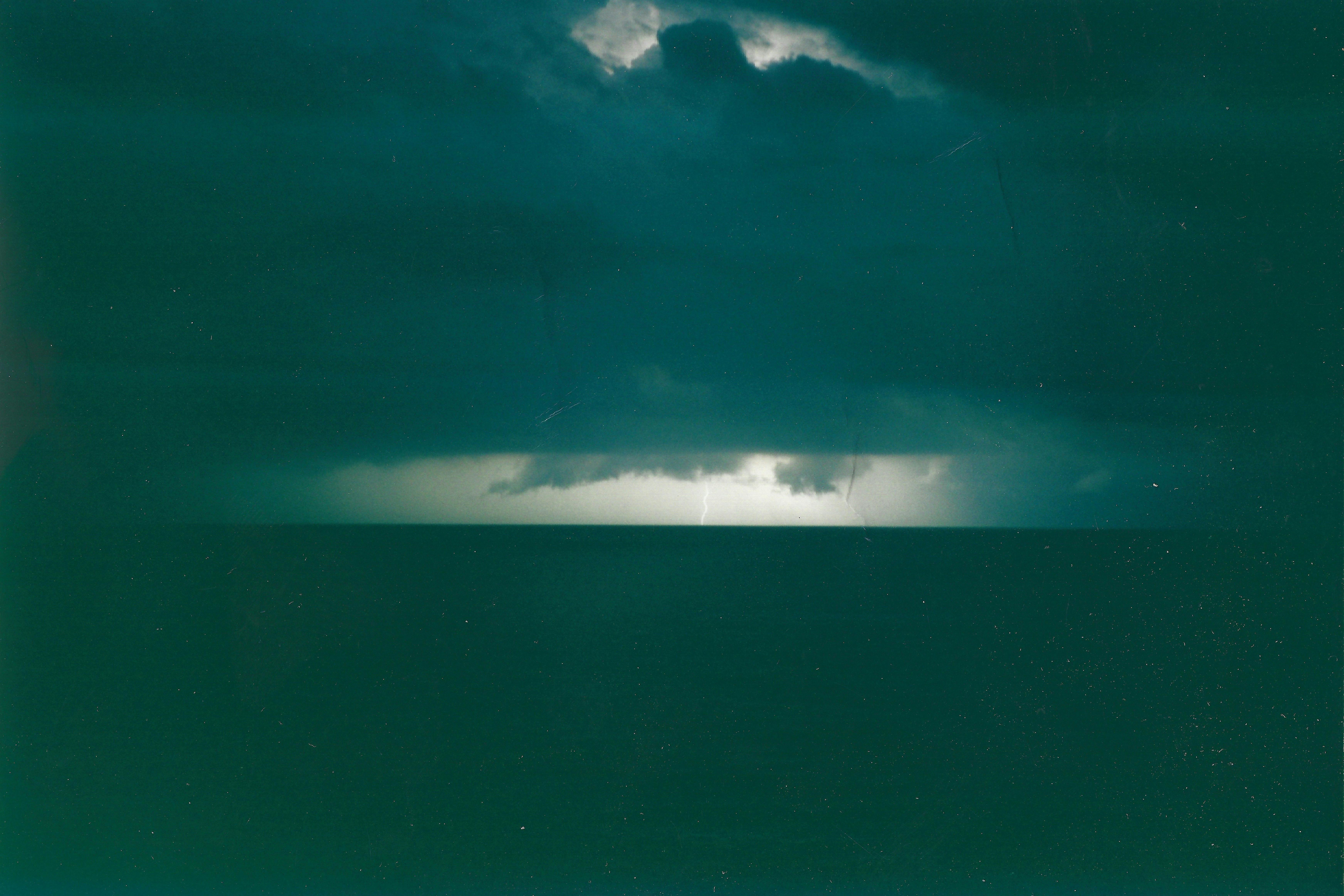 lightning on the horizon striking the sea