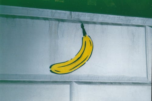 A banana is painted on a wall