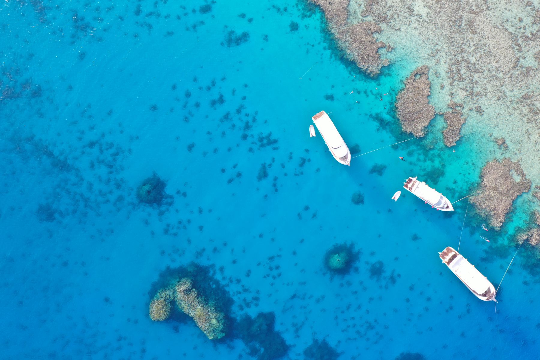 Aerial view of the turquoise lagoon and sandbank at Orange Bay island, Red Sea