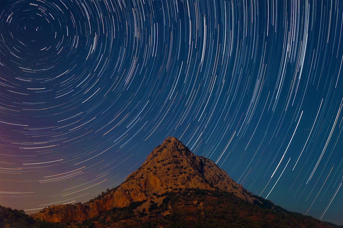 Free Mountain Under A Starry Sky In Timelapse Mode Stock Photo