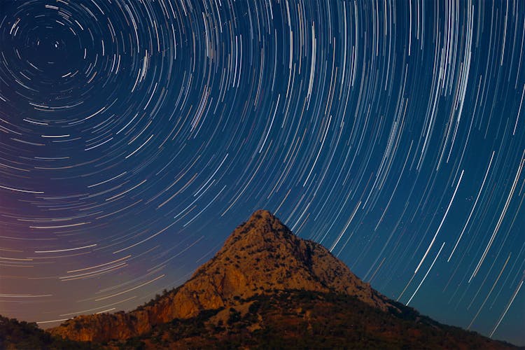 Mountain Under A Starry Sky In Timelapse Mode