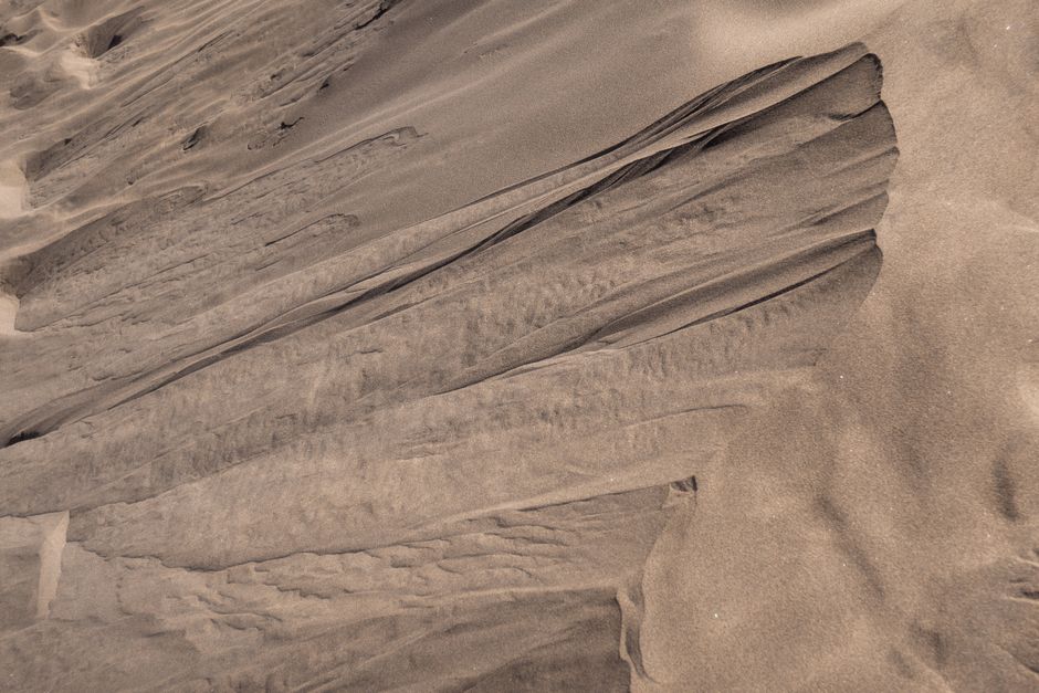 Explore the mesmerizing textures of the sand dunes in Canary Islands, Spain. Perfect for backgrounds.