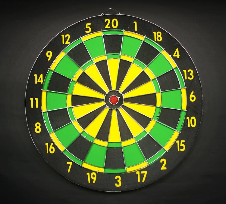 Green Yellow And Black Round Dart Board With Black Background