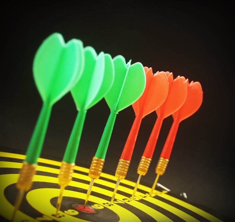 Free Assorted Color Dart Pins on Dart Board Stock Photo