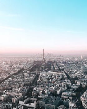 Explore Paris's iconic skyline with an aerial view of the Eiffel Tower.